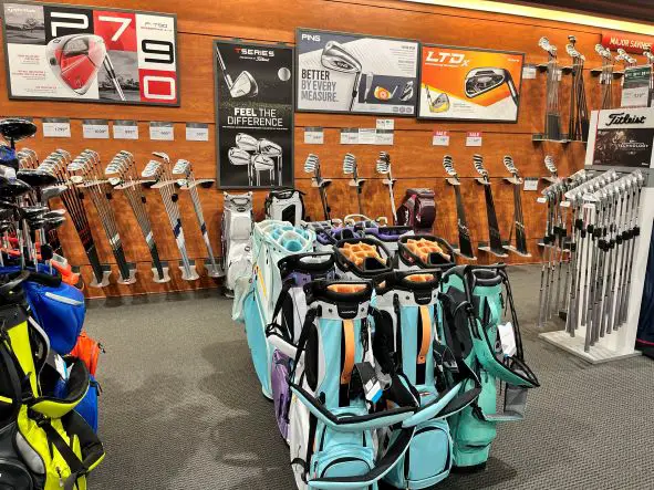 bunch of golf club sets in Dicks sporting goods store