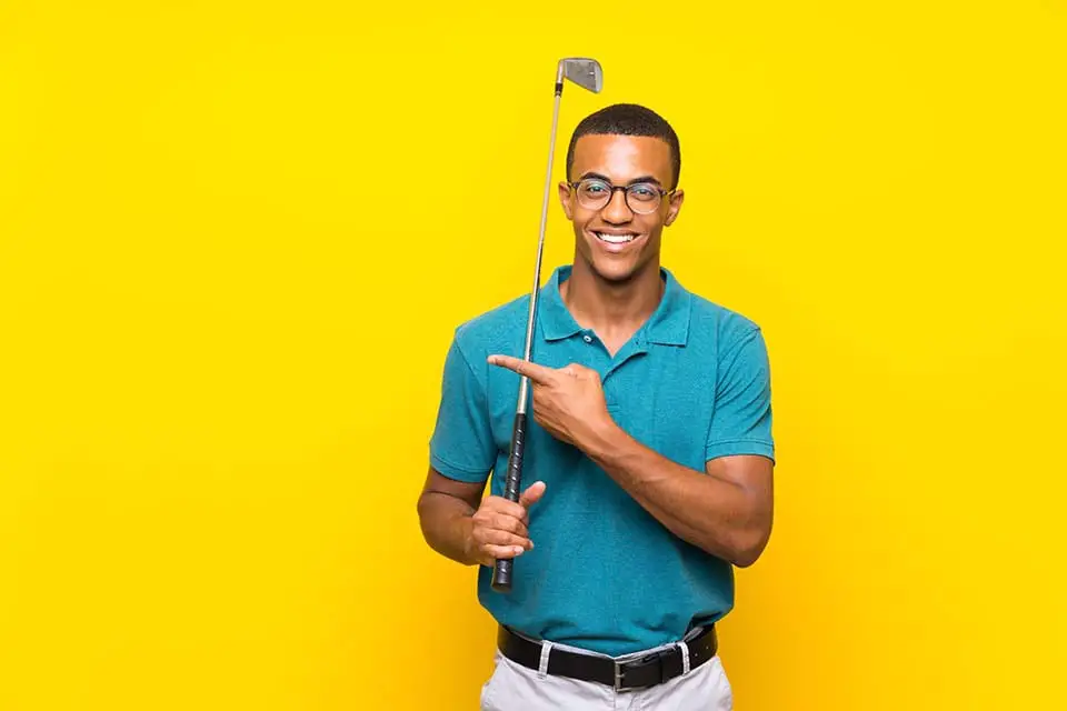 golfer player man pointing to the side to present a product